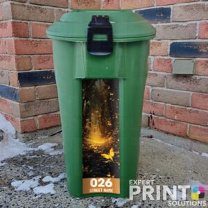 Vibrant yellow butterfly filled forest Green Bin Sticker