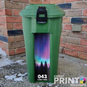 Colorful northern lights illuminate the night sky Green Bin Sticker