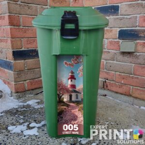 Picturesque lighthouse and blooming cherry trees Green Bin Sticker