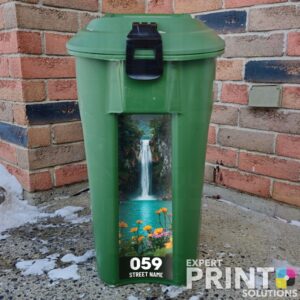 Stunning waterfall with orange and pink flowers Green Bin Sticker